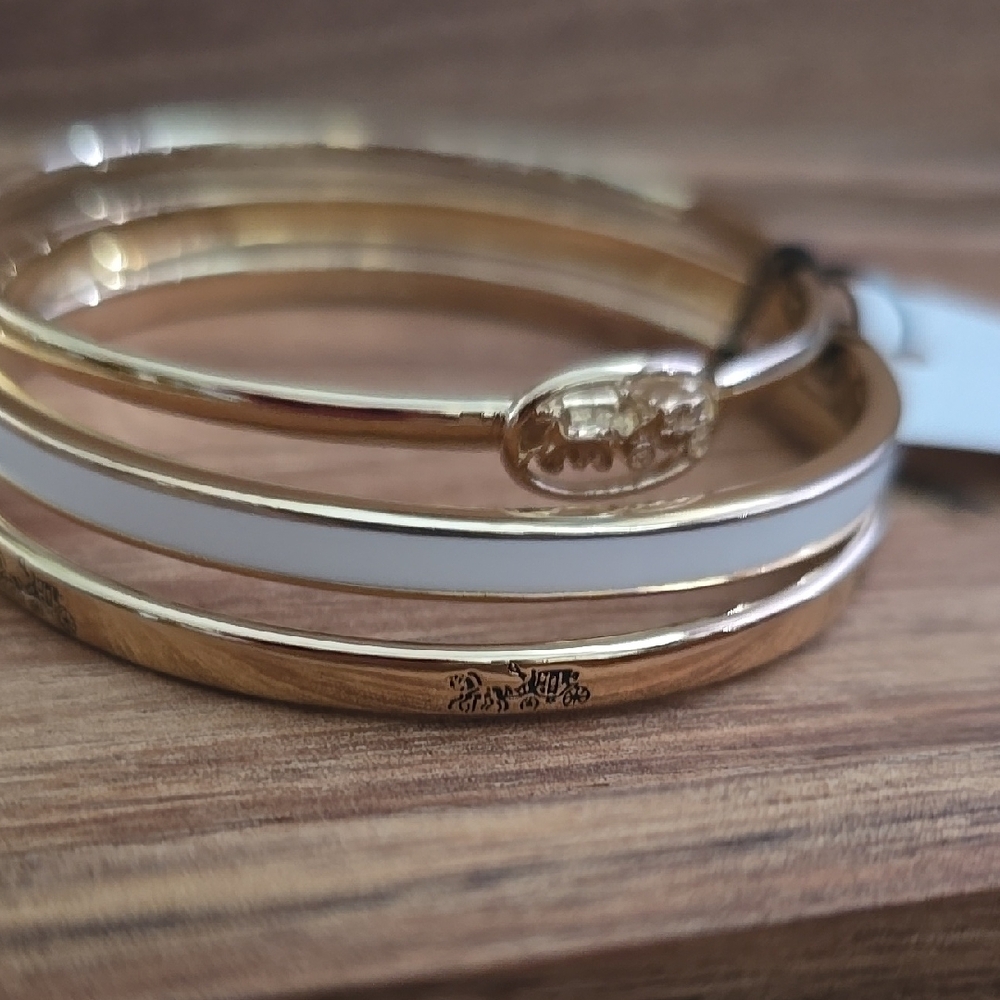 Coach Gold and White Bracelet Set Sleek Minimalist Design